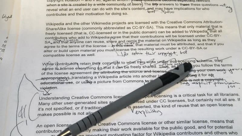 A manuscript page covered in red-pen corrections and edits — common French conjugation mistakes to avoid